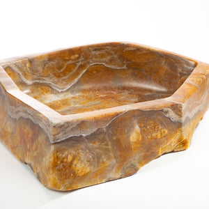 BOWL CARVED OUT OF STONE
