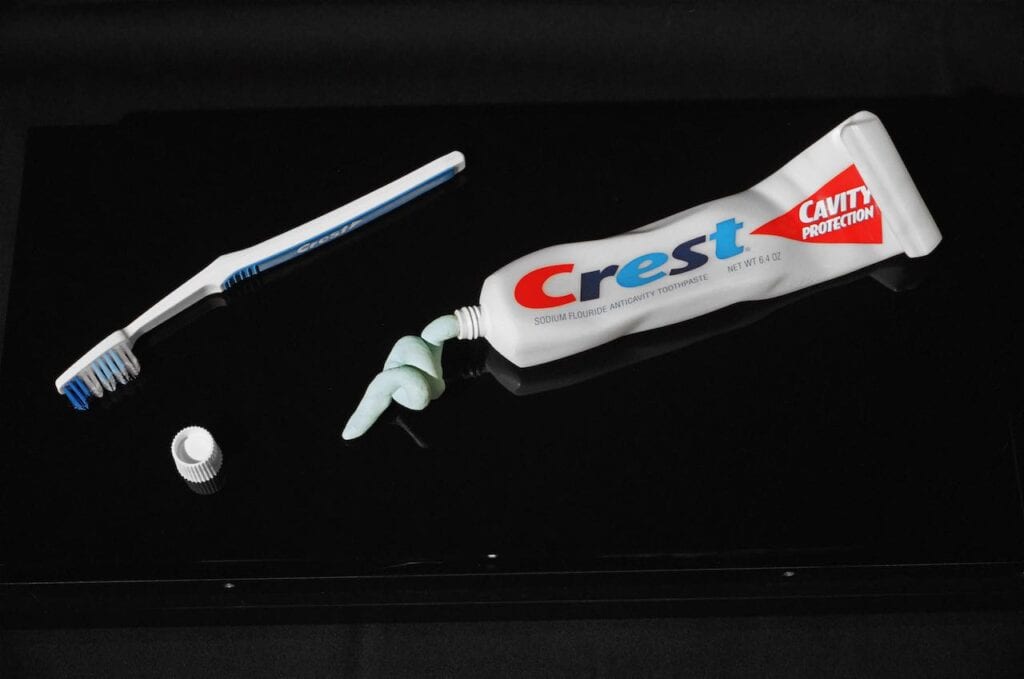 Tube: marble and vinyl; Toothpaste: resin; Cap and toothbrush are real objects