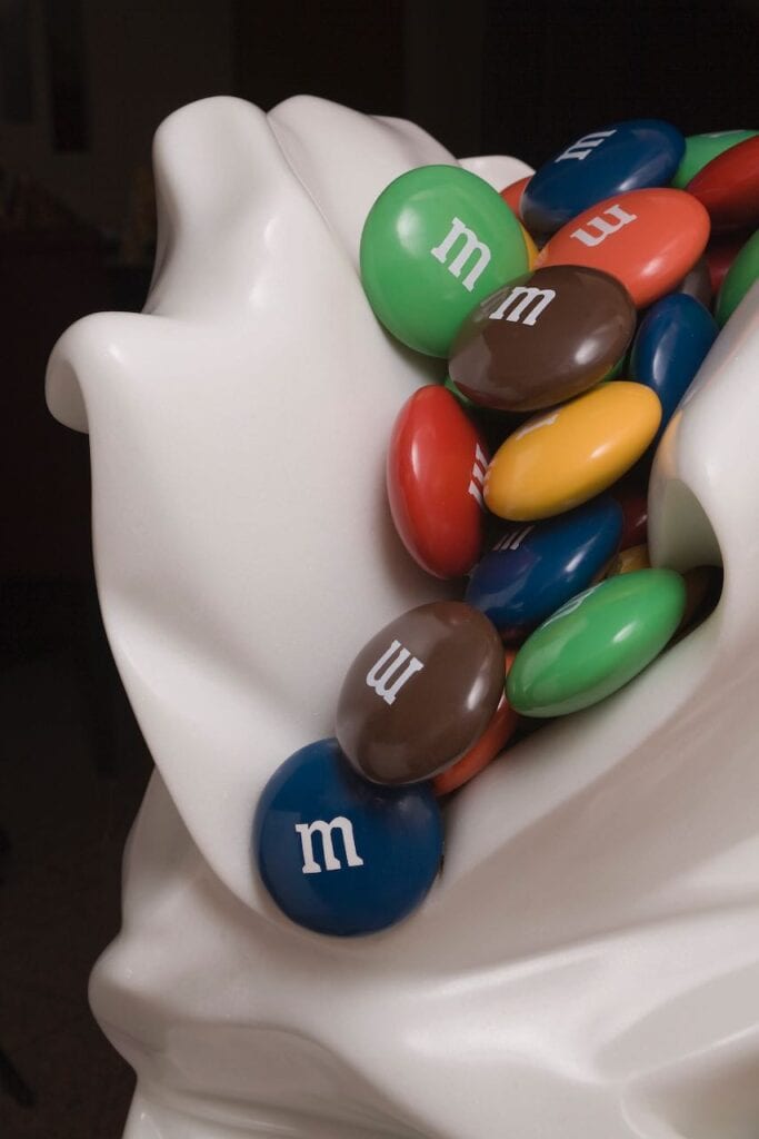 Bag: marble; M&M’s: carved out of marble and cast in resin